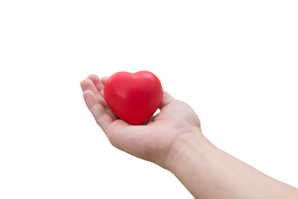 红心球:压力释放泡沫球，红心形状的女性手孤立在白色背景与剪切路径图片下载