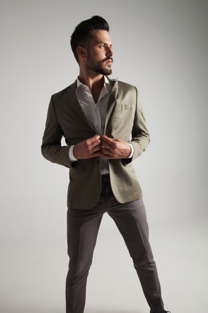 优雅男子的肖像系着他的绿色西装图片下载