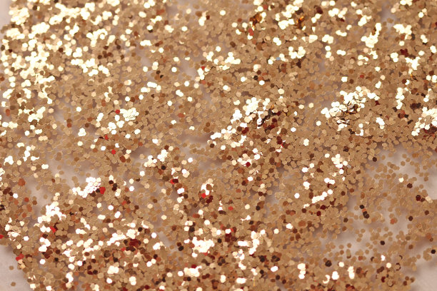 金色闪亮的背景。明亮的金色背景，闪闪发光图片下载