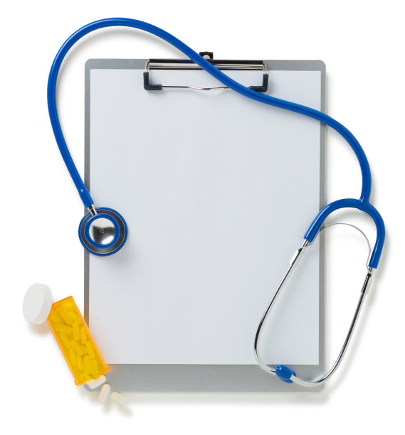 带听诊器的写字板，白色上有一瓶药丸图片下载