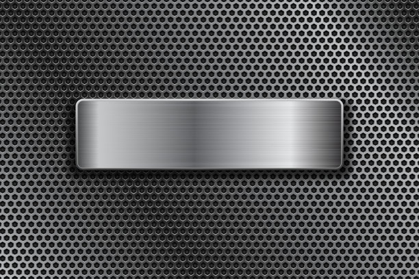 闪亮的钢板上的金属穿孔背景图片下载
