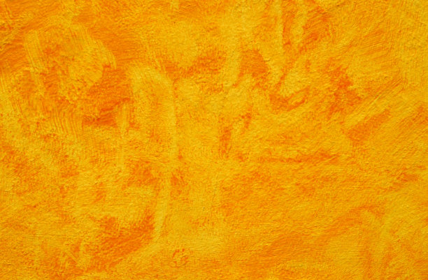 明亮的黄色油漆墙面纹理背景。室内或室外装饰的概念。图片下载