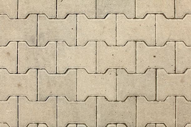 顶视图城市石材地板纹理被阳光照射。图片下载