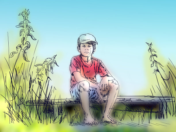 一个男孩坐在草地上图片下载