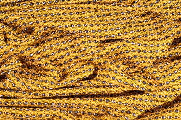 棉织物是棕色的，带有圆圈图案。光滑别致但仍然狂野的一面，不要错过这款Python印花弹力棉缎图片下载