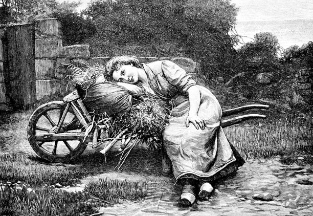 年轻女子坐在手推车上休息图片下载