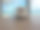 一杯咖啡放在一张木桌上，背景是热带海景。图片下载