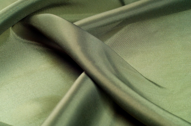 橄榄色的织物。橄榄绿的。纹理图片下载