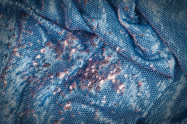 质地、背景、模式。蓝色绣花丝织物图片下载