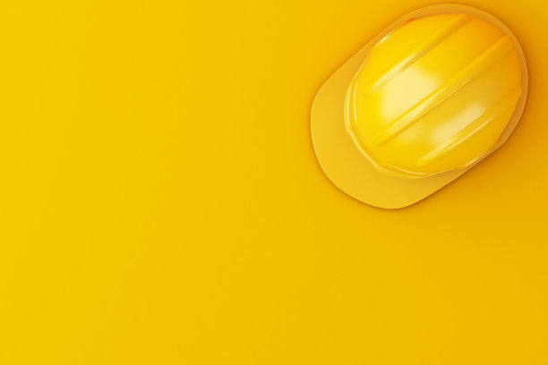 橙色背景上的3d安全帽。图片下载