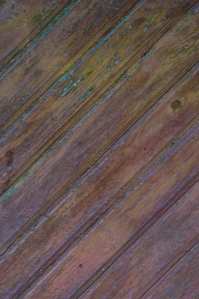 五颜六色的垃圾纹理和破旧的油漆。色彩丰富的复古，复古背景与不同层次的油漆。用于设计的库存照片。图片下载