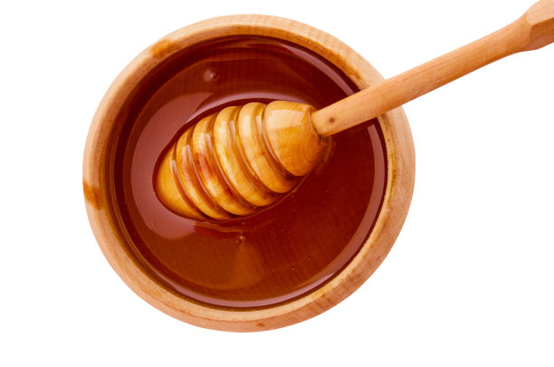 蜜罐和木勺棒孤立在白色背景与剪切路径图片下载