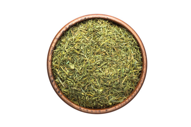 干燥的莳萝香料在木碗，孤立在白色背景。调味料俯视图图片下载