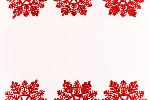 红色的雪花在白色的背景图片下载