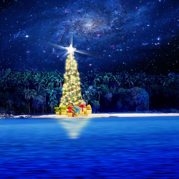 在银河系上空的热带小岛上的圣诞树图片下载