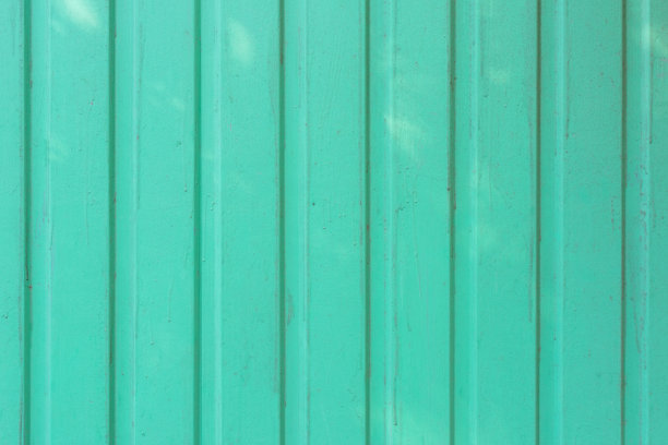 光滑板的背景用绿色油漆油漆。纹理有油漆污点。特写照片。图片下载
