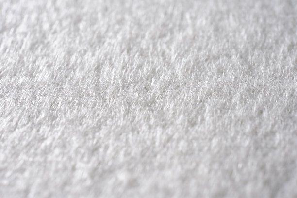 极端特写的白色织物纹理背景。图片下载