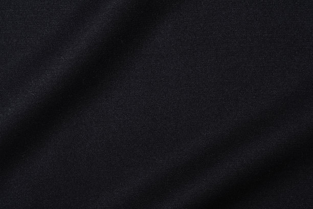 黑色织物的深色纹理背景。图片下载