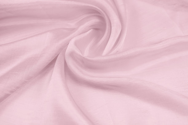 以粉红色为背景的缎子织物的纹理图片下载