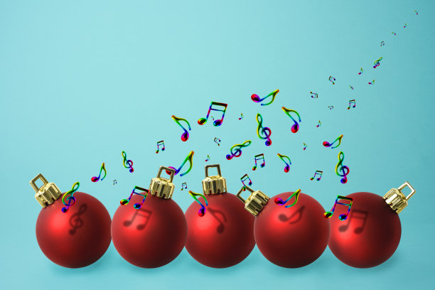 五个红色圣诞球和飞舞的音符。图片下载