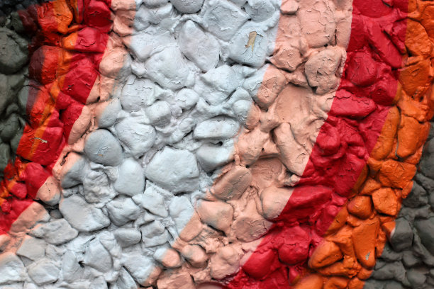 彩色的石头。墙面被漆成不同的颜色，有不同的纹理风格。枯燥乏味的背景图片下载