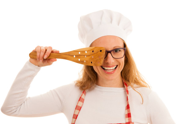 美丽的年轻厨师烹饪工作室隔离在白色的背景图片下载