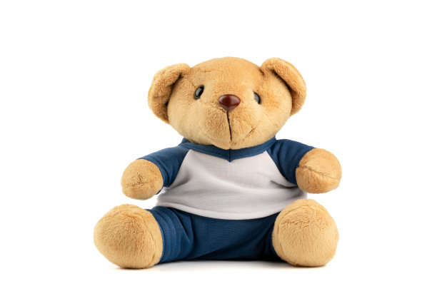 棕色泰迪熊的特写穿着白色的蓝色衬衫玩具的孩子孤立在白色的背景。图片下载