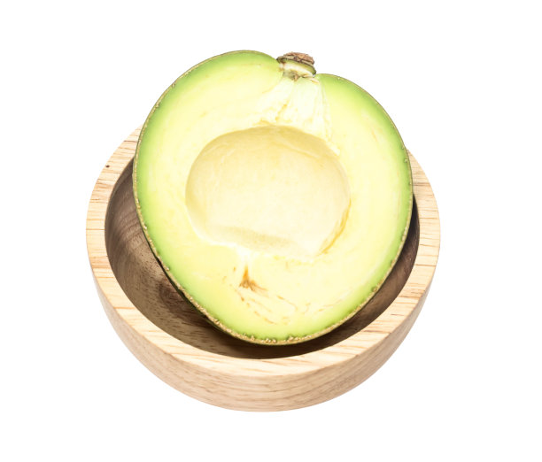 半张绿色的泰国鳄梨放在木质的白色背景上图片下载