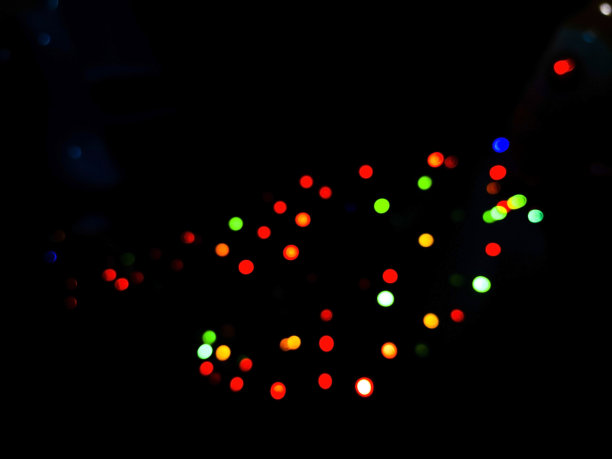 彩色圆形散景背景来自LED灯。图片下载