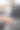 这名男子坐在一辆客车的方向盘后面，拉起手刹。图片下载