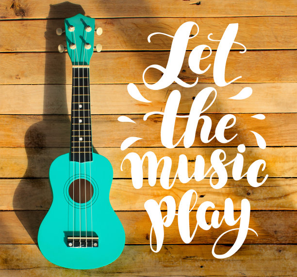 吉他照片和手写数字文字“让音乐播放”。音乐邮票,海报。图片下载