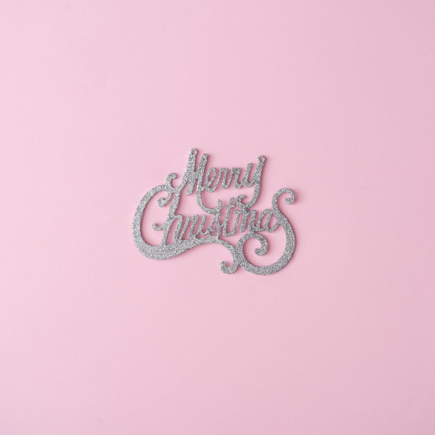 粉色背景上的圣诞闪光标志。图片下载