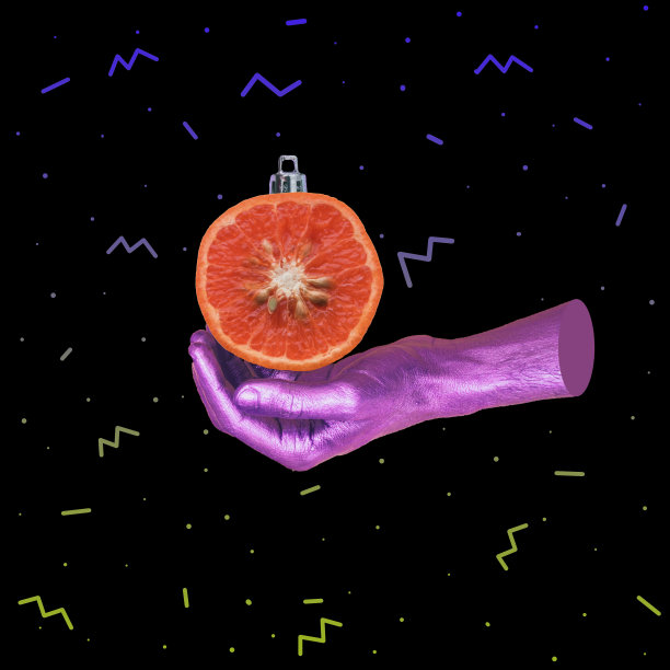 彩绘手握圣诞树装饰球形状的橘子水果。图片下载