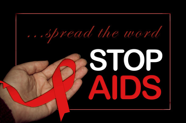手持红丝带庆祝世界艾滋病日的妇女图片下载