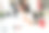 一个戴着耳机的小女孩坐在办公室的电脑桌前，手里拿着平板电脑。图片下载