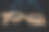 多边形公牛和熊的形状写的线和点与闪耀的风格在粒子的大地黑色背景，交易和金融投资的概念图片下载