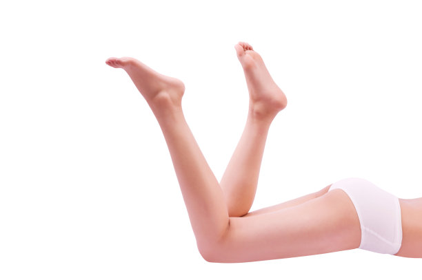 美丽的女性的腿和身体在白色的背景，工作室拍摄图片下载