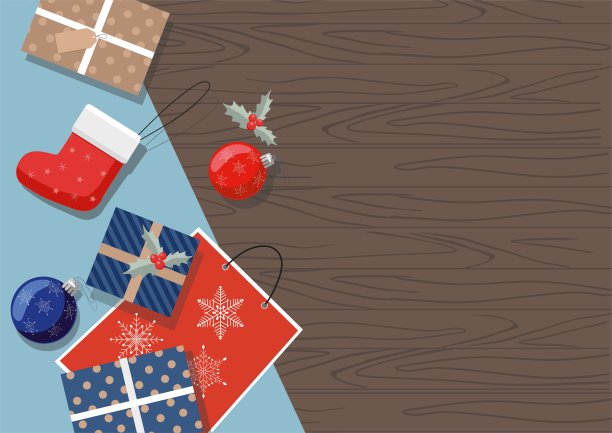 桌子上放着圣诞礼物，球和袜子。前视图。图片下载