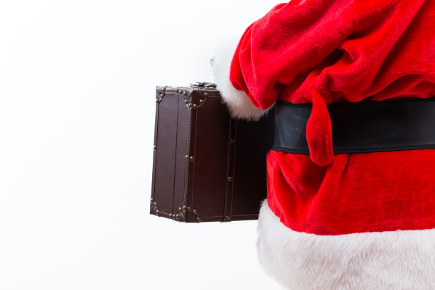 拿着皮箱的圣诞老人图片下载