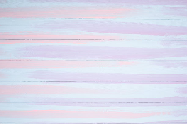 白色、蓝色和粉红色的漆衬在木制的背景上。图片下载
