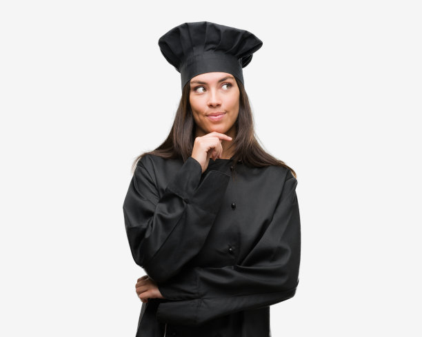 年轻的西班牙女厨师穿着厨师服严肃地面对思考问题，非常困惑的想法图片下载