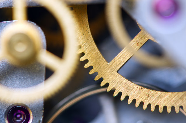 背景与金属齿轮发条。概念性照片为您成功的业务设计。宏。图片下载