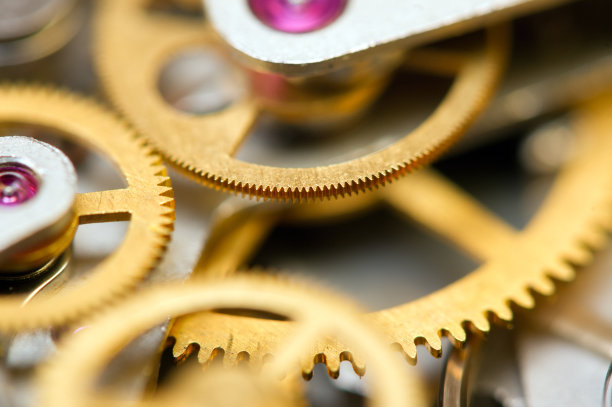 背景与金属齿轮发条。概念性照片为您成功的业务设计。宏。图片下载
