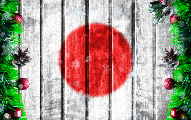 木制的圣诞背景与模糊的日本国旗。照片中有一个地方可以放你的文字图片下载