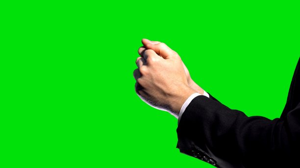 商业制裁，绿幕上握紧拳头，经济冲突图片下载