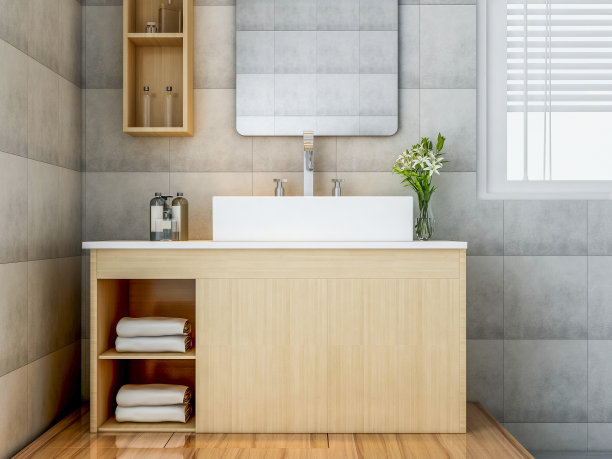 浴室中的浴室，白色的橱柜，上面有白色的干净毛巾，绿色的植物在柜台上，旁边是玻璃窗图片下载