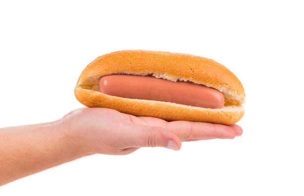 手拿生热狗。图片下载