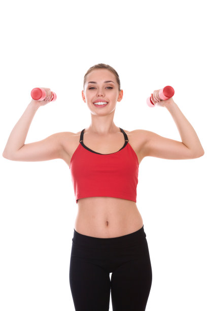 一个拿着哑铃的年轻女人的肖像图片下载