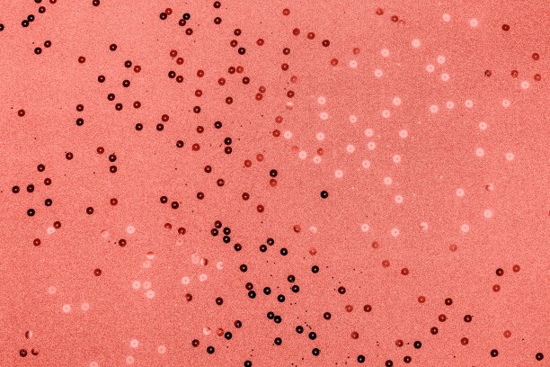 活珊瑚色与金属五彩纸屑的节日装饰概念。图片下载