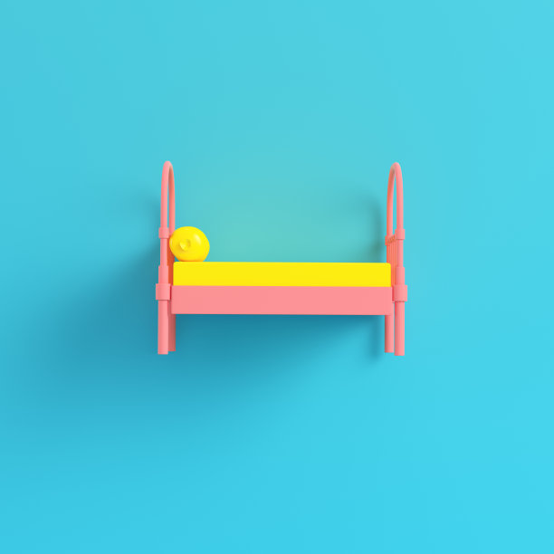 粉红色单人床，枕头，亮蓝色背景，色彩柔和图片下载